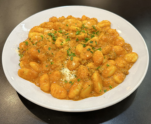 Homemade gnocchi with slow-simmered bolognese meat sauce