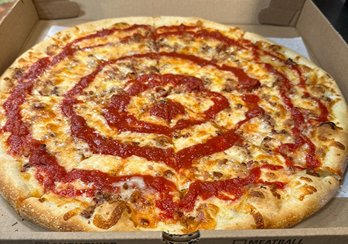 Dino's signature chicken wing pizza with buffalo sauce and mozzarella
